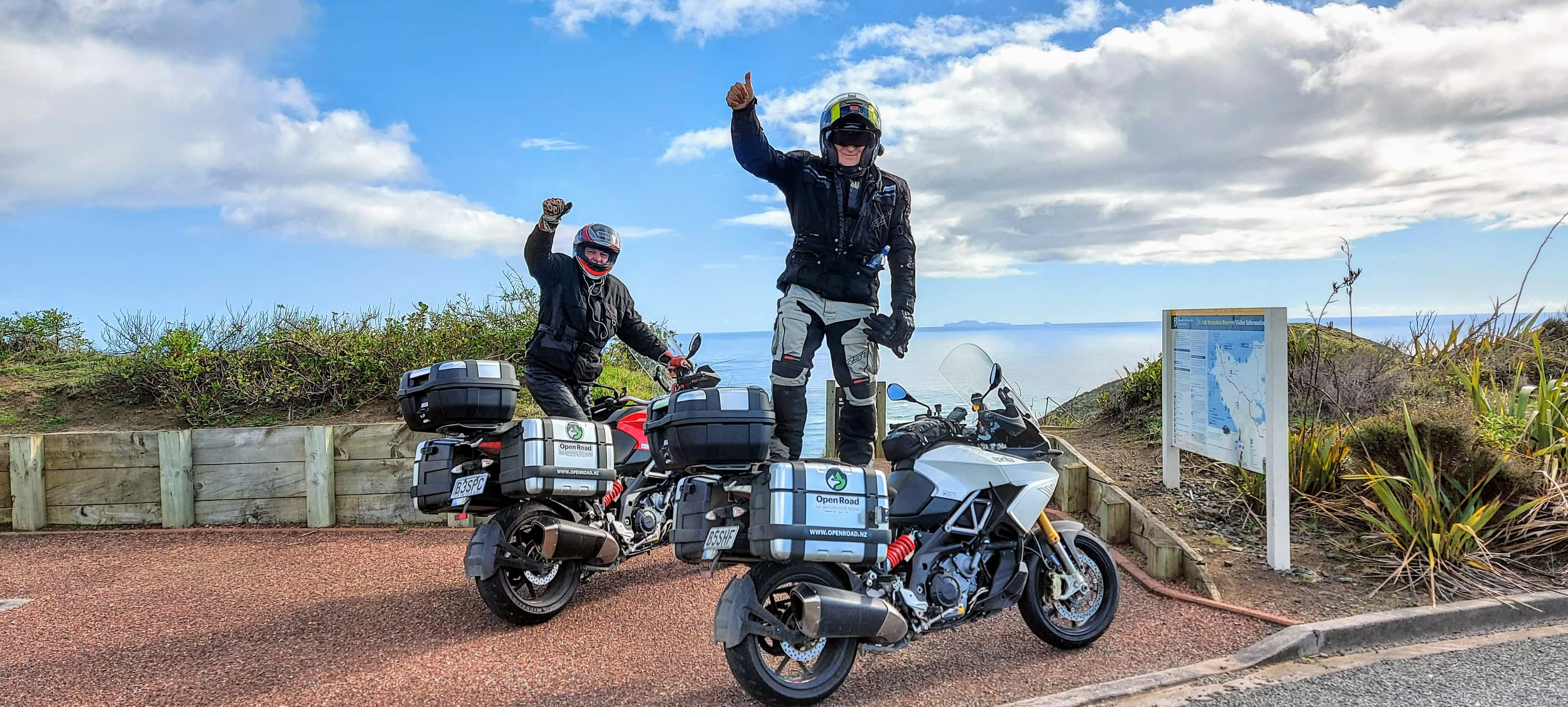 Windy road with a motorcycle in the distance